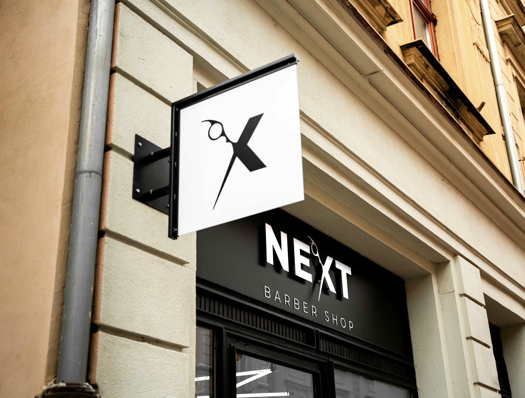 Logo a označení Next Barber Shop Plzeň